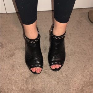 Black leather zip up heels with silver studs